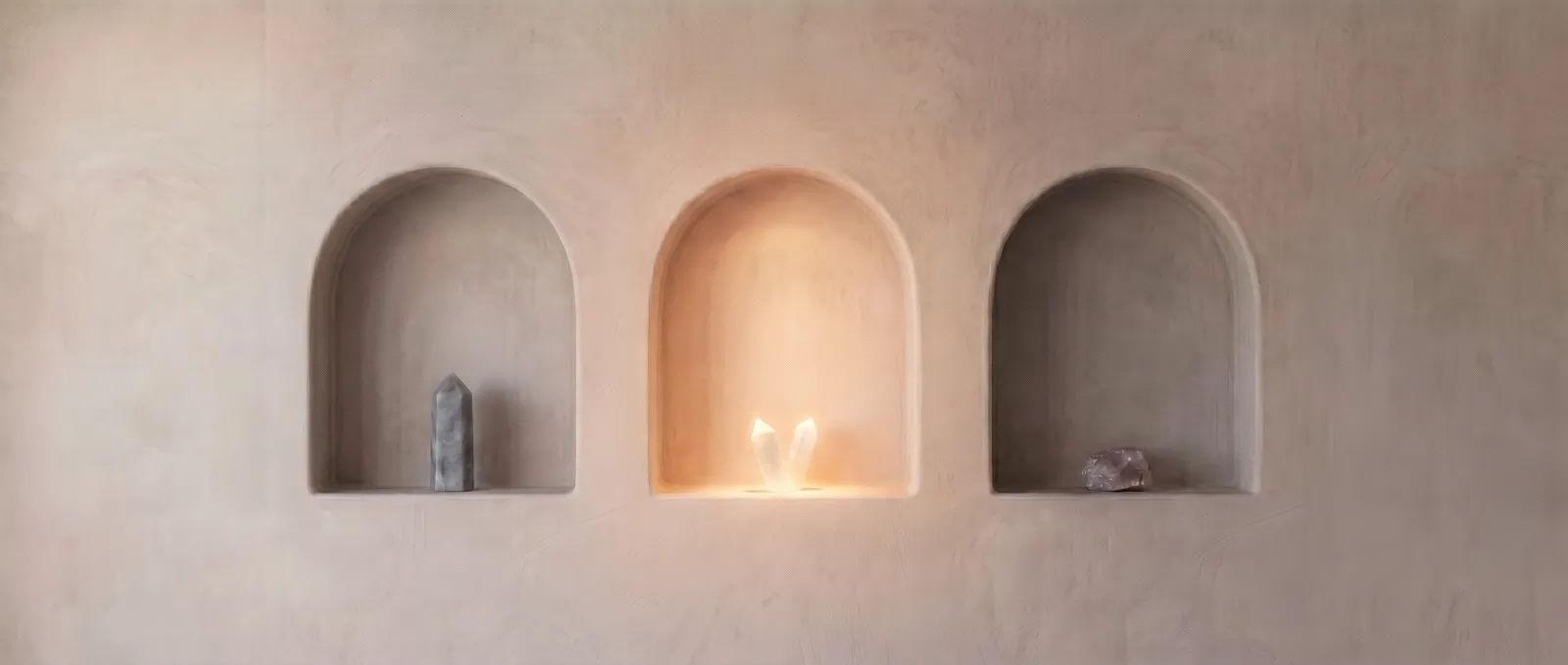 The three plaster niches with the second arch lit, marking the treatment